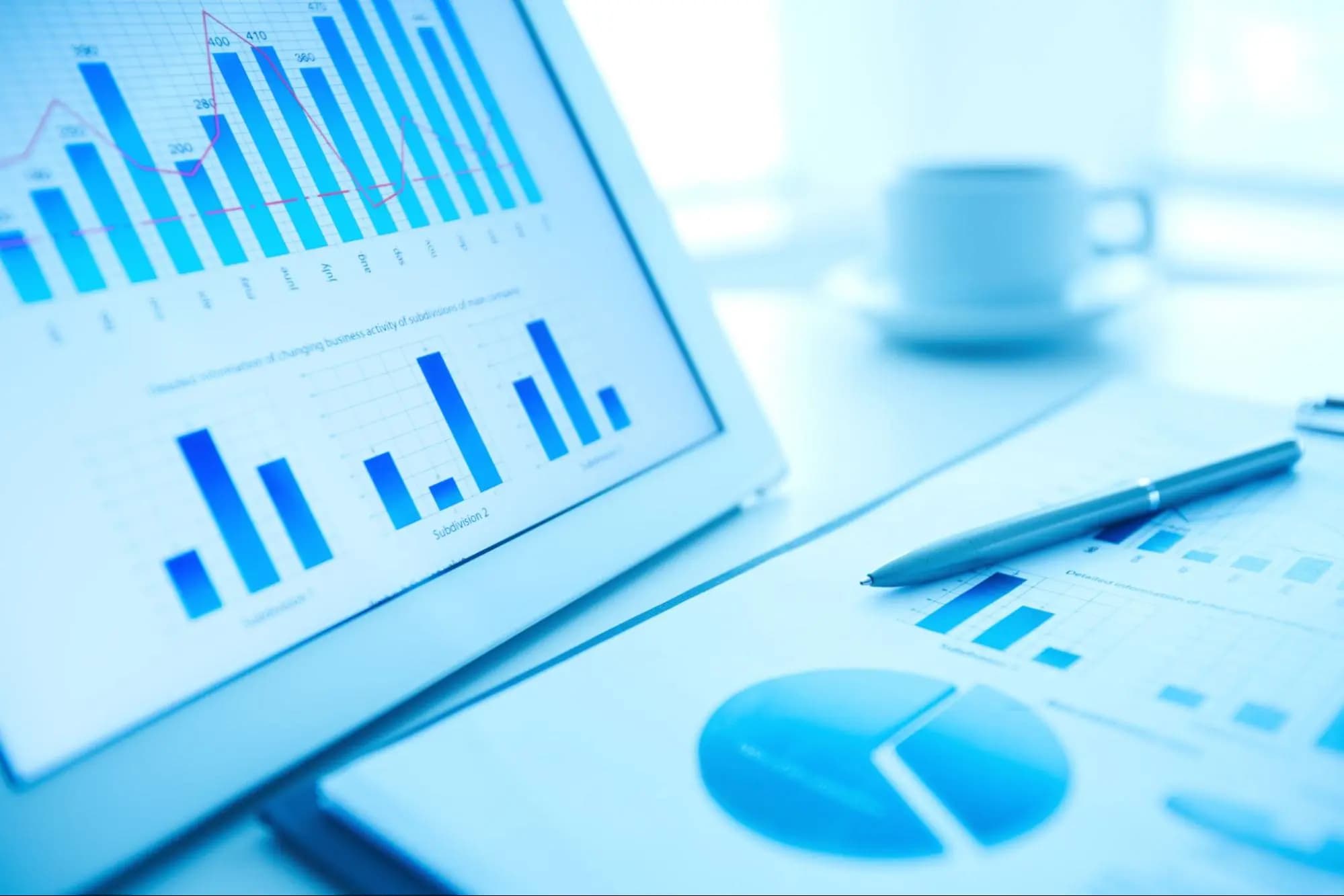 Analytics dashboards and charts on a laptop screen showing campaign performance results