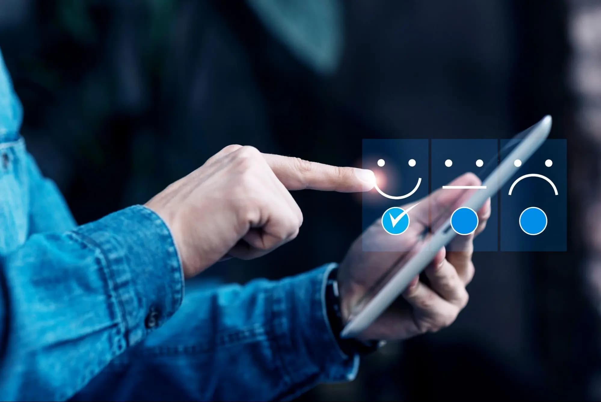 Person selecting a positive feedback rating on a tablet, representing the delivered experience being received